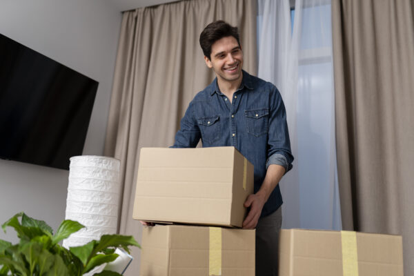 man-handling-belongings-after-moving-new-home