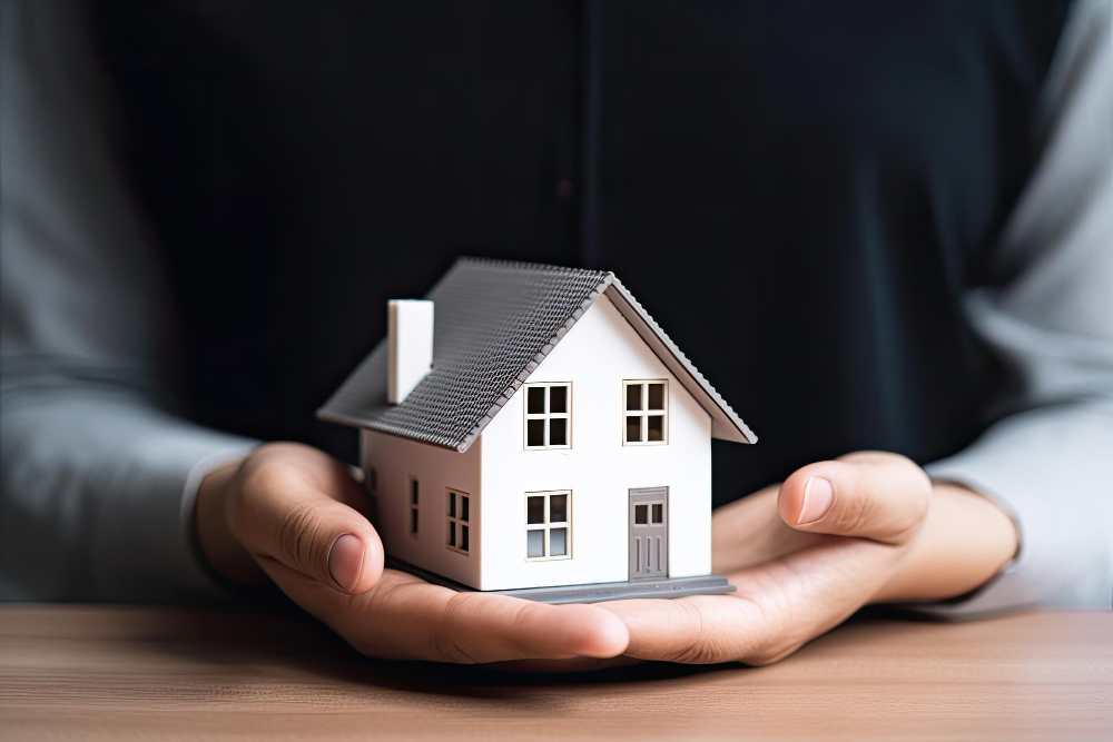hands-holding-a-model-house